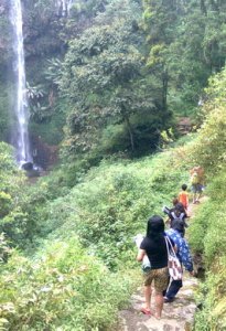 walking down through trap path to Coban Ondo waterfall Malang